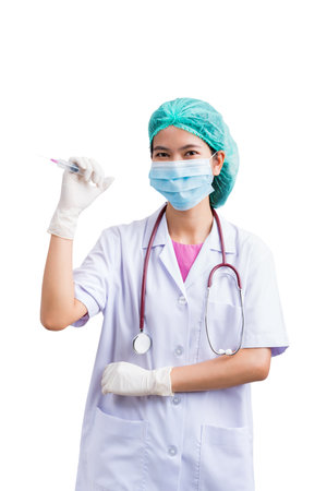 Portrait of Medical physician doctor or nurse uniform wearing surgical mask and vaccine dose flu shot drug syringe isolated on white background, mature female medical nurse or practitioner with stethoscope look at camera. Healthcare conceptの写真素材