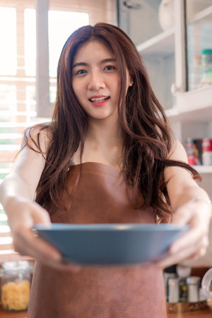 woman chef cook or housewife preparing food in kitchen, Cooking and preparing food meal concept.の写真素材