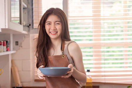 woman chef cook or housewife preparing food in kitchen, Cooking and preparing food meal concept.の写真素材