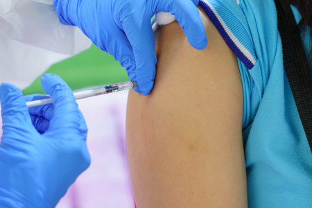 Nurse holding a syringe for the injection giving patient vaccine in hospital. Health care Concept.