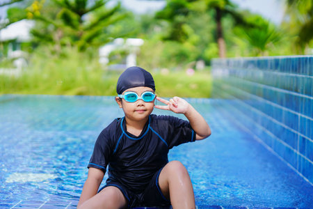 happy children Smiling cute little girl in sunglasses in swimming pool.の写真素材