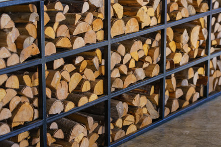Firewood stacked up in a pile for abstract backgroundの写真素材