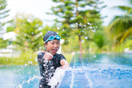 happy children Smiling cute little girl in sunglasses in swimming poolの写真素材