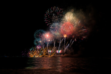 Colorful fireworks of various colors at night with celebration and anniversary concept.の写真素材