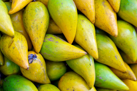 Egg fruit or Canistel on sale sale in fruits market. (pouteria campechiana.)の写真素材