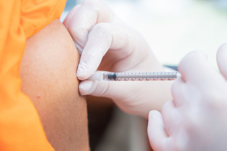 Nurse holding a syringe for the injection giving patient vaccine in hospital. Health care Conceptの写真素材