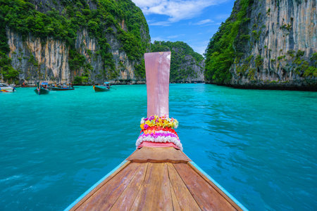 Traveling with long tail boat on fantastic emerald lagoon sea at Koh Phi Phi Island Thailand, Pileh Lagoon.の写真素材
