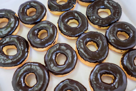Delicious donuts and vanilla with chocolate frosted, sweet baked dessert.の写真素材