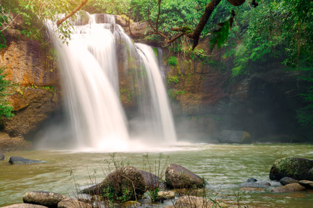 Beautiful waterfall with sunlight in jungle, Haew Suwat Waterfall at khao yai Nakhonratchasima province.の写真素材