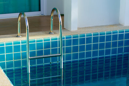 blue swimming pool at hotel with stair.の写真素材
