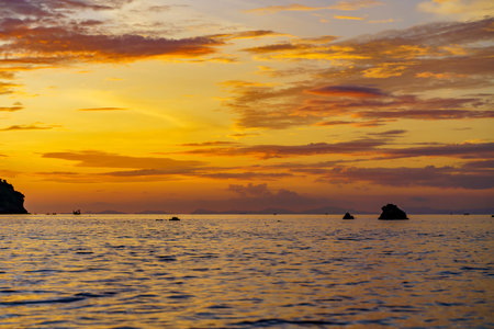 Sea among rocks on evening sunset. Island in tropical waters at Andaman sea Thailand. Summer landscape.の写真素材