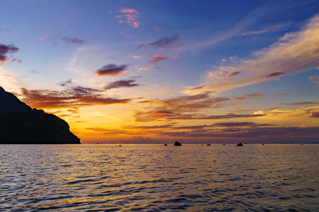 Sea among rocks on evening sunset. Island in tropical waters at Andaman sea Thailand. Summer landscape.の写真素材