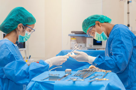 Medical physician doctor or Surgery team in operation room with lighting at hospitalの写真素材