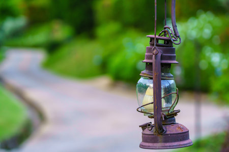 Vintage lamp on footpath with green meadow field.の写真素材