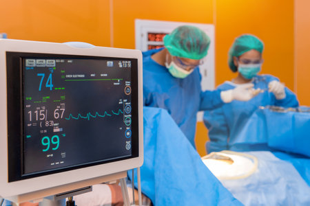 Defibrillator with Medical physician doctor or Surgery team in ICU operation room  at hospitalの写真素材