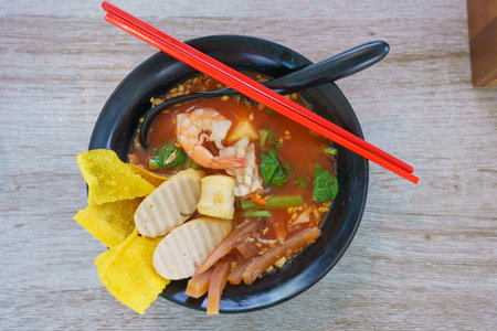 Pink Noodle Soup or Yen Ta Fo noodle with fish ball, Thai food.