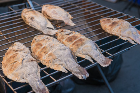 fresh delicious grilled fish, tilapia, Salt grilled fish Local Foods of Thailand.の写真素材