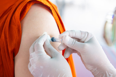 Nurse holding a syringe for the injection giving patient vaccine in hospital. Health care Concept.の写真素材