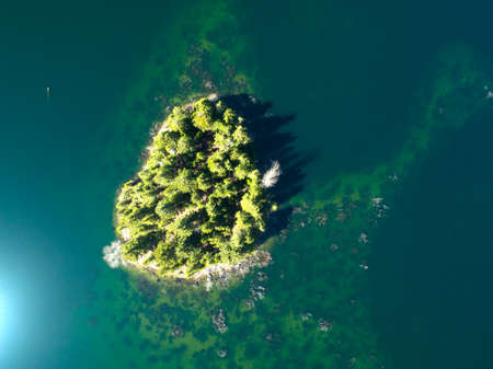 Small Island From Above Emerald Green Lakeの写真素材