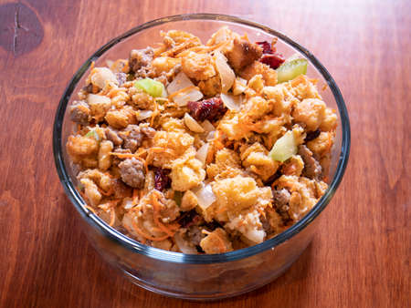 Holiday Stuffing With Beef Carrots Bread Celery Almonds Onions Crutons Cranberries In Glass Serving Bowlの写真素材
