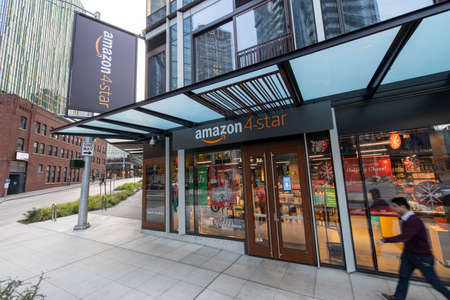 Seattle, Washington USA - Dec 2, 2019: Man Walking Outside Amazon 4-Star Cashierless Storeのeditorial素材
