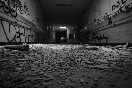 Abandoned building filled with debris from dilapidation and decay over timeの素材