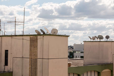 TV Satellite dishes sitting atop apartment buildings in Brasilia, Brazilの写真素材