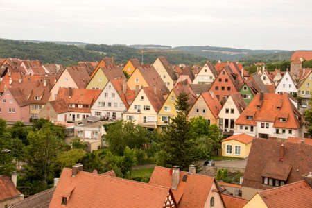 Rothenburg ob der tauber, Germany August 17, 2019: View of Part of the Stonewall and Towers that Surrounds the Medieval City of Rothenburg with Wind Turbines in the far backgroundのeditorial素材