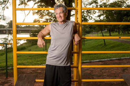 Senior Man Relaxing after Working out at a Fitness Park