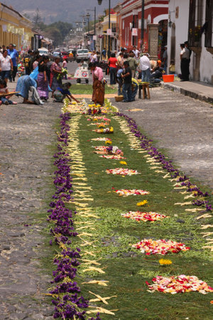Antigua , Guatemala, April 10, 2009: The colorful carpets made out of Sawdust known as Alfrombras, line the Streets of Antigua, during Holy Weekのeditorial素材