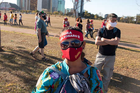 Brasilia, Brazil, DF July 25, 2021: A woman protesting against the current administrationâs handling of the Covid-19 Vaccine.のeditorial素材
