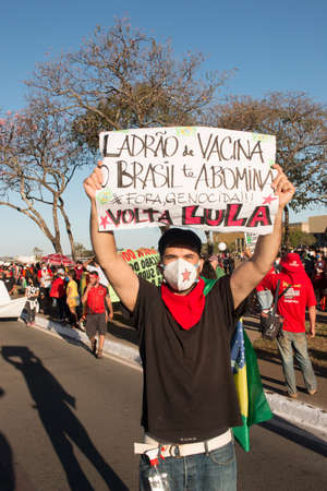 Brasilia, Brazil, DF July 25, 2021: A massive protest in the capital city and also throughout Brazil, against the current administrationâs handling of the Covid-19 Vaccine.のeditorial素材