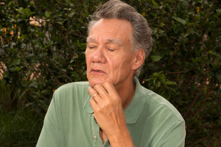 Senior man outside in deep thought about something