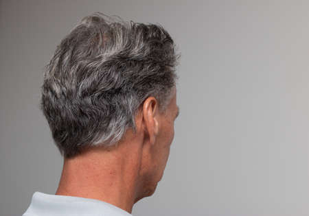 Mature man with salt and pepper hair starting to turn grayの写真素材