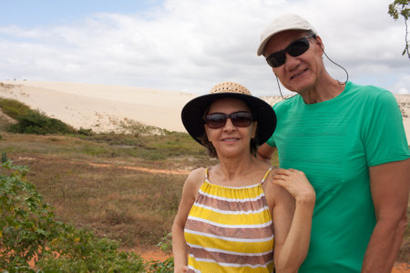 Couple standing at the Sand Dunes that are in Combuco, Brazilの写真素材