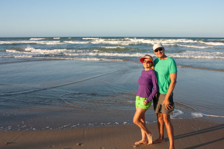 Couple at the beach in Fortaleza, Brazil, known as Future Beach in the late afternoonの写真素材