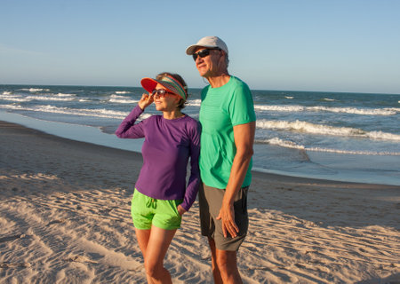 Couple at the beach in Fortaleza, Brazil, known as Future Beach in the late afternoonの写真素材