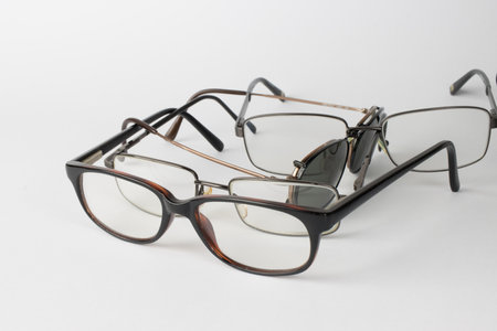 A bunch of old prescription eyeglasses