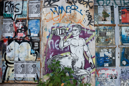 Athens, Greece, December 15 2023 Colorful but unlawful graffiti plastered on walls and city building...