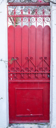 Old red wooden door in the city of Athens, Greeceの写真素材