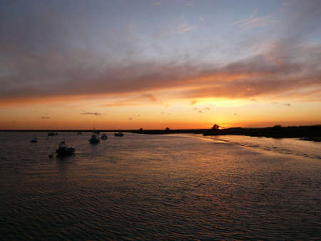 A characteristically beautiful sun set over the sea on the East Coast of Englandの写真素材