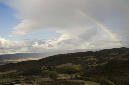a rainbow after a storm above the spanish countrysideの写真素材