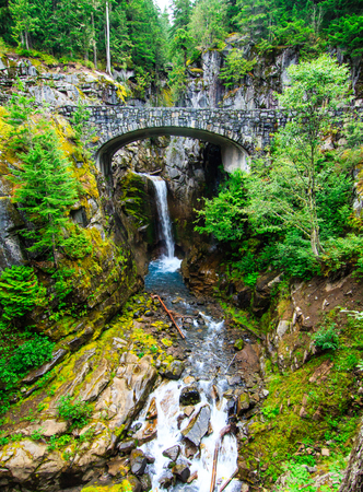 The Christie bridge and waterfall in Mt. Rainier National Park, Washington.の写真素材