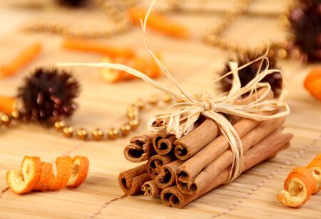 Sticks of the cinnamon with the orange peel