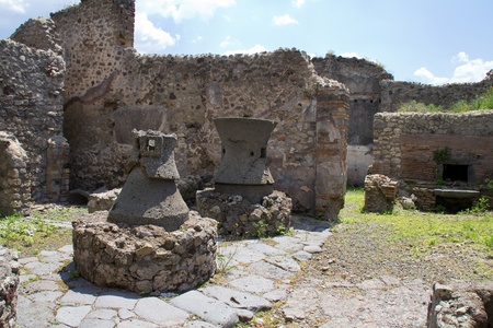 Ancient kitchen kilns used to cook food for a restaurant in Pompeiiの写真素材