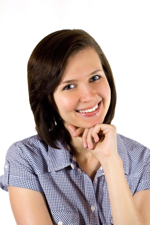 Attractive young woman resting her chin on handの写真素材