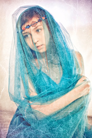 Beautiful forest fairy - portrait of teen girl under the veilの写真素材