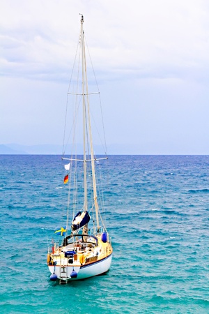 The large, beautiful yacht in the light-blue seaの写真素材