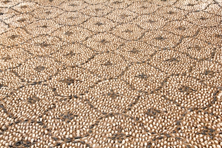 Pavement with smooth stones, cobblestone texture