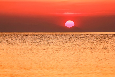 The sun rising above Mediterranean Seaの写真素材